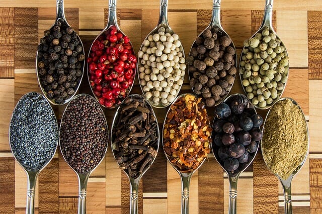 Image of spices - salt, pepper, paprika, mustard, ginger, anice, cardamon, cumin.